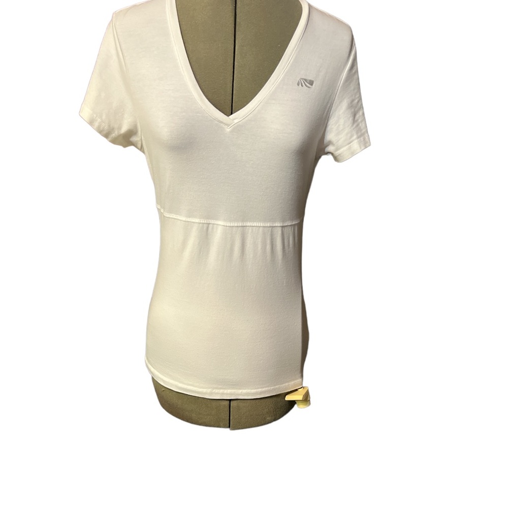 White body suit T shirt. Has stretch cloth underneath top portion.